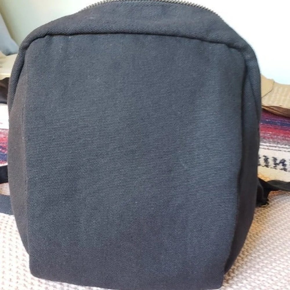 Small, handmade black canvas backpack